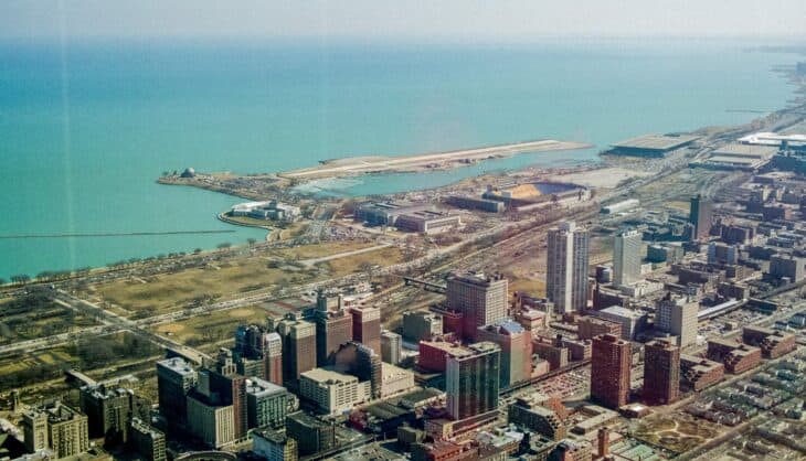 Aerial photograph of Meigs Field's single runway on a peninsula beside downtown Chicago in 1995