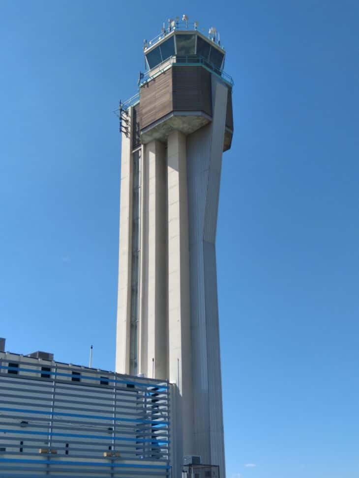 The former Stapleton International Airport control tower in Denver against a blue sky