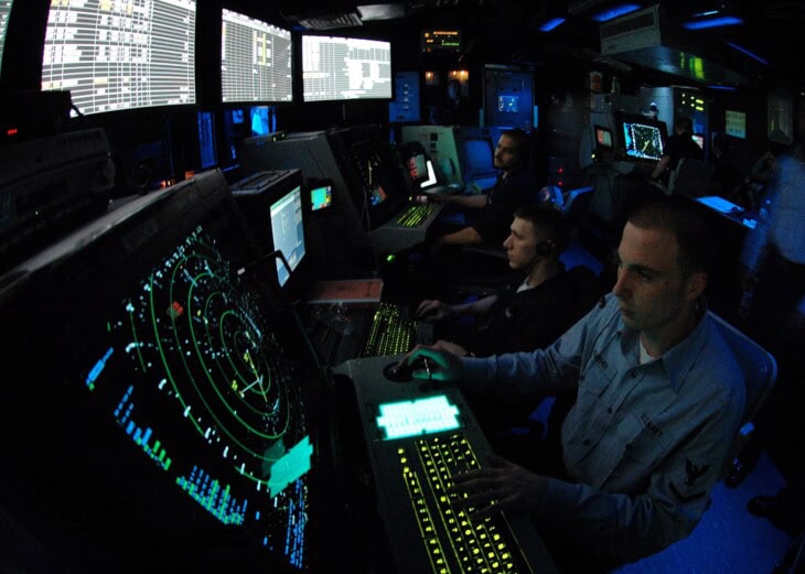 air traffic controller works approach control in Carrier Air Traffic Control Center aboard the Nimitz-class aircraft carrier USS Abraham Lincoln in 2006