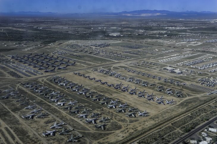 Rows of retired US military aircraft parked across the desert at the 309th AMARG, Davis-Monthan Air Force Base, seen from the air
