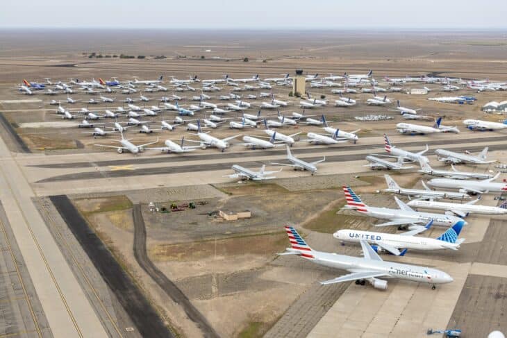 Aerial view of dozens of stored airliners, including United Airlines widebodies, on the ramps at Roswell Air Center