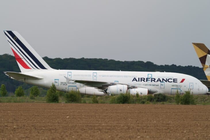 Air France Airbus A380 F-HPJH parked in storage at Tarmac Aerosave, Tarbes, with trees behind