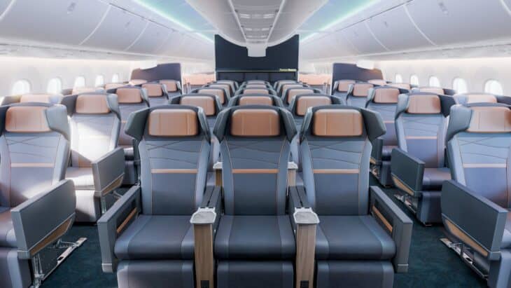 Rendering of an Alaska Airlines 787 Premium Reserve cabin with rows of grey recliners with copper headrests