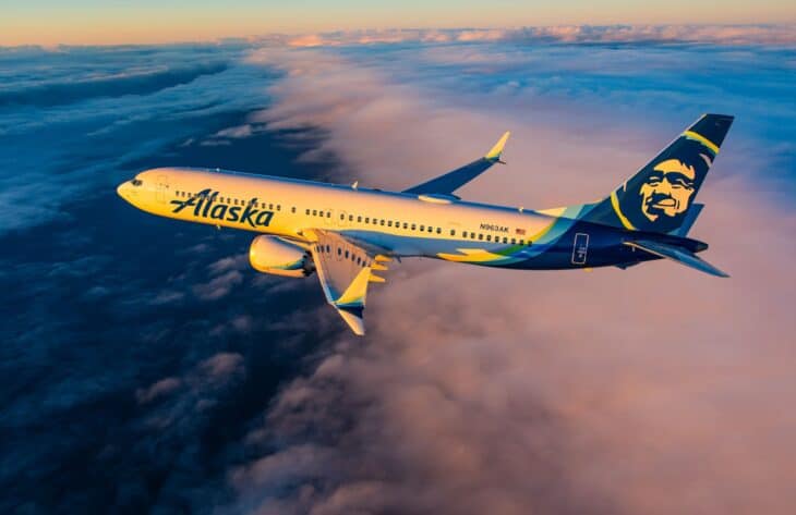 Alaska Airlines Boeing 737 MAX 9 N963AK flying above a layer of cloud at sunset