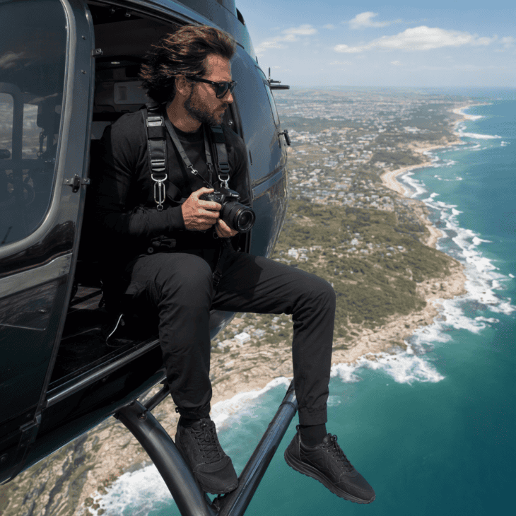 Matte black clothing keeps your own reflection out of the glass and off the lens.