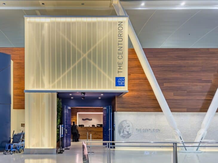 The glass-and-wood entrance of the American Express Centurion Lounge in JFK Terminal 4