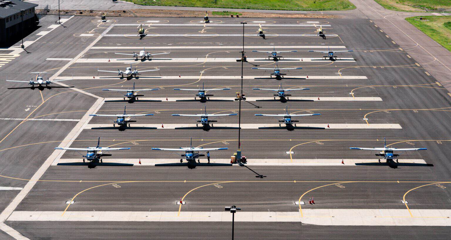 Rows of Embry-Riddle training aircraft parked on the Prescott, Arizona flight line, seen from above