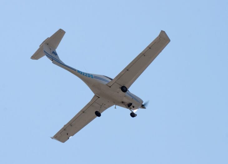 Middle Tennessee State University Diamond DA40 N922DS seen from below in flight against a blue sky