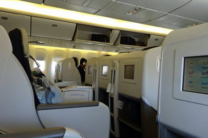 An Air France business class cabin on Boeing 777-200ER F-GSPJ, with high seat shells and overhead bins