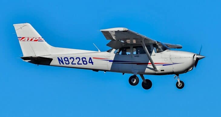 ATP Flight School Cessna 172S Skyhawk N92264 in flight against a clear blue sky