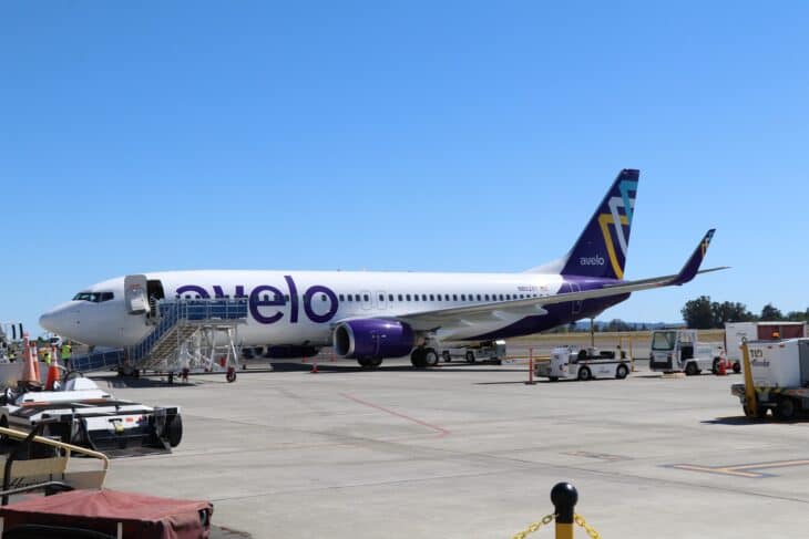 Avelo Airlines Boeing 737-800 N802XT parked on the ramp with airstairs at the door