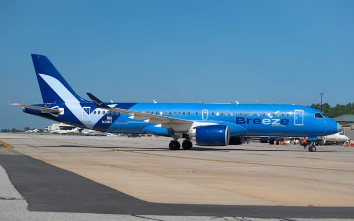 Breeze Airways Airbus A220-300 N211BZ in the blue livery taxiing on the ramp