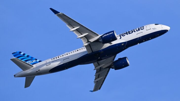 JetBlue Airways Airbus A220-300 N3125J climbing away after takeoff, seen from below
