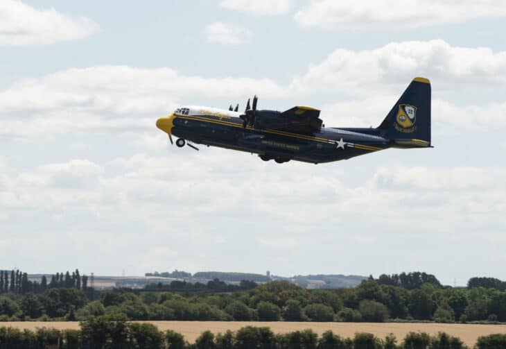 The Blue Angels' blue and gold C-130J Super Hercules Fat Albert taking off with its landing gear still down