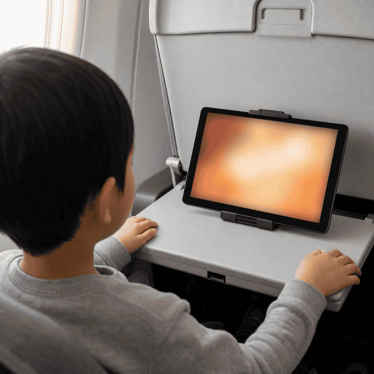 A stand at eye level saves both the child's neck and your arm.