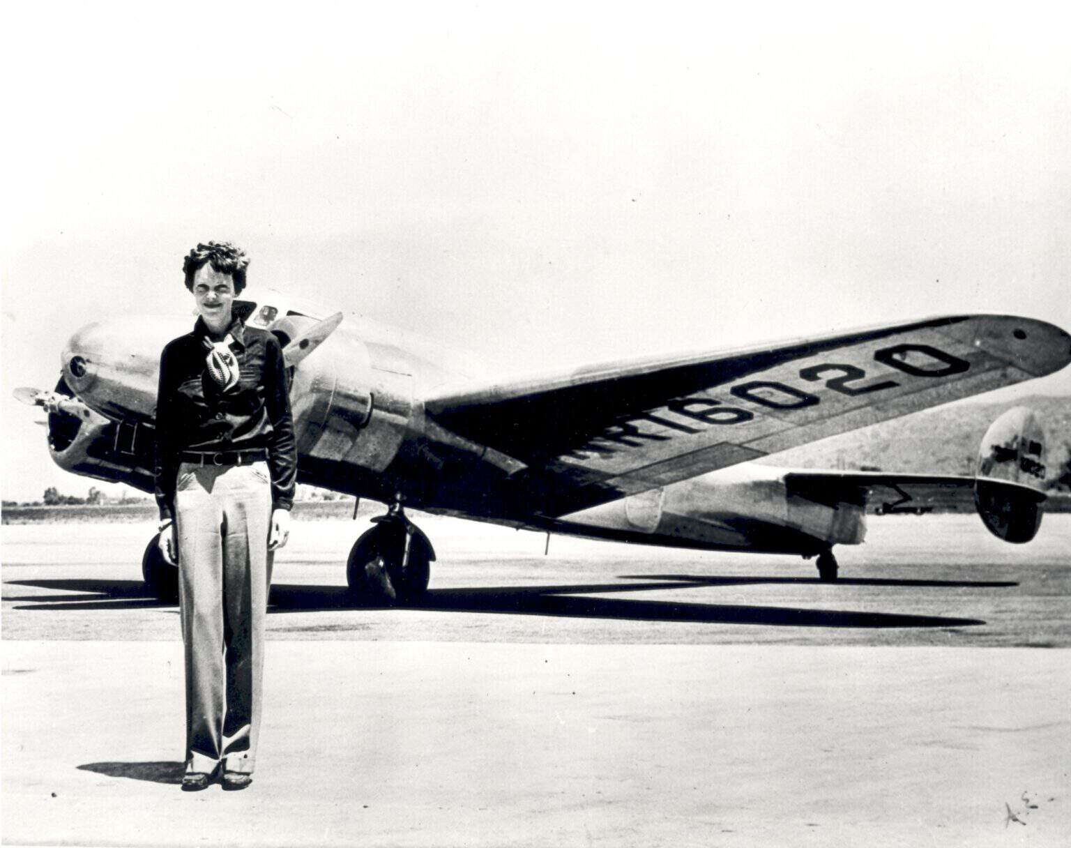 Amelia Earhart standing in front of her Lockheed Electra 10E, registration NR16020