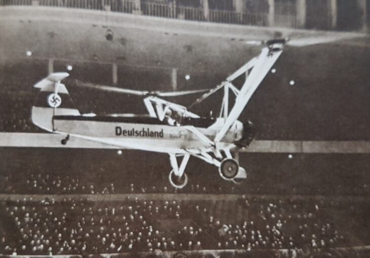 The Focke-Wulf Fw 61 helicopter hovering inside the Deutschlandhalle arena in Berlin
