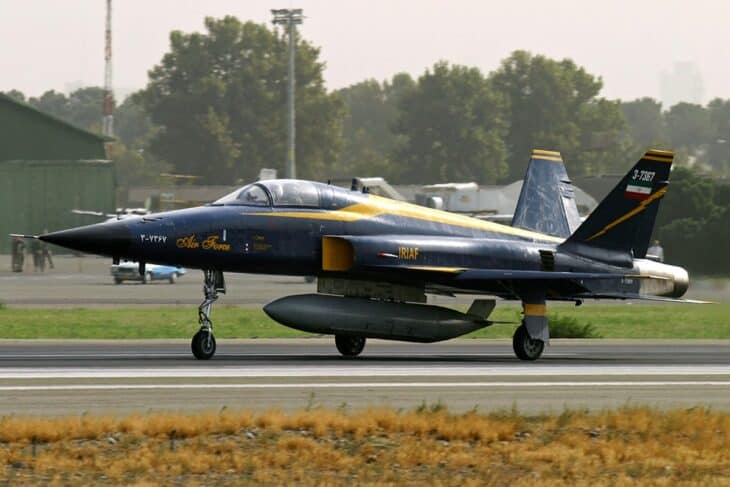An IRIAF HESA Saeqeh, an Iranian-built twin-tail derivative of the F-5, on the runway in dark blue and yellow markings