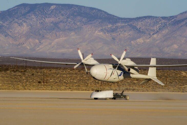 Boeing Phantom Eye lifting off from its launch cart on a desert lakebed