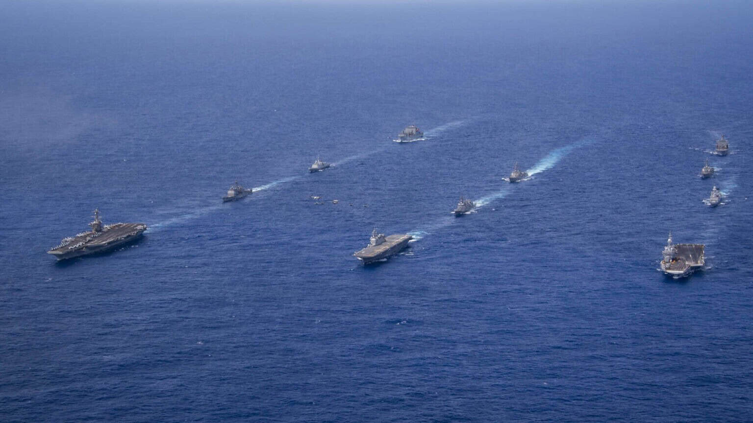 Warships of the Carl Vinson Carrier Strike Group, the French Carrier Strike Group and the Japan Maritime Self Defense Force sailing in formation in the Philippine Sea