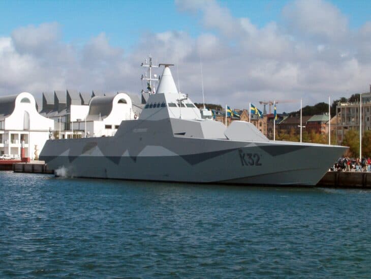 The Swedish Navy Visby class stealth corvette HSwMS Helsingborg alongside, showing its faceted radar absorbing hull