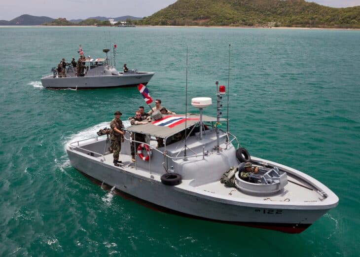 Royal Thai Navy sailors aboard riverine patrol boats during a warfare demonstration with US Navy personnel