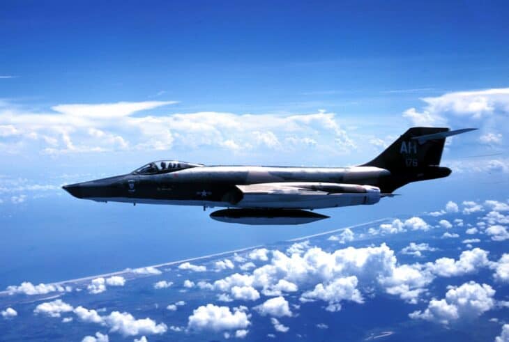 Camouflaged U.S. Air Force RF-101C Voodoo 56-0176 of the 45th Tactical Reconnaissance Squadron in flight above clouds