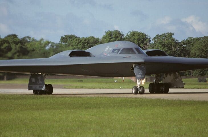The B-2A Spirit of Alaska of the 509th Bomb Wing waits for takeoff clearance at the end of the runway.