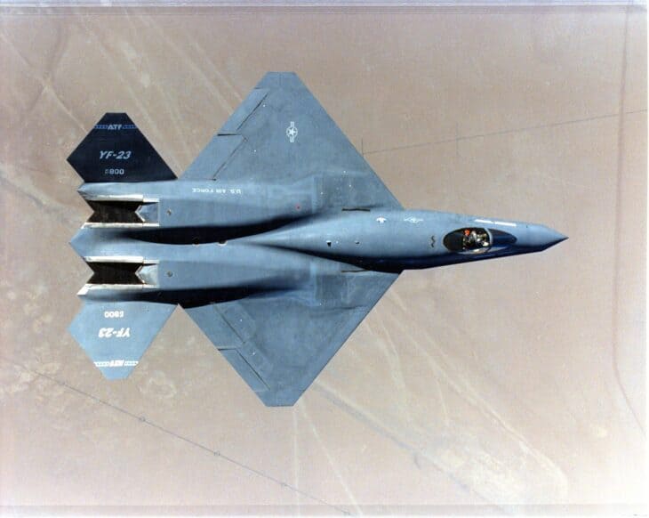 YF-23 PAV-1 photographed from above in flight, showing its diamond-shaped wing, twin engine humps and V-shaped tails