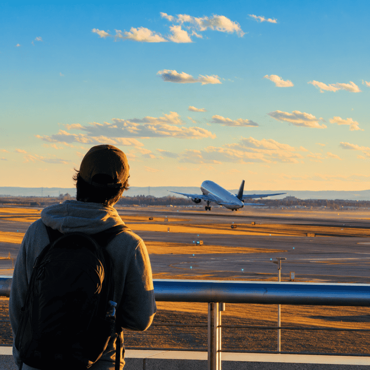 A dedicated viewing deck lets you frame a traveler against a full runway and open sky.