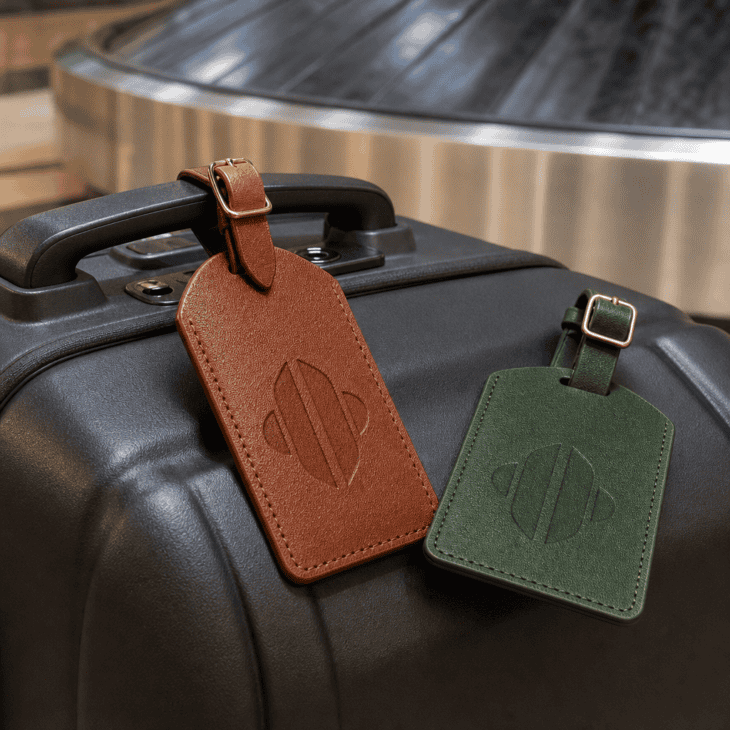 A personalized leather tag rides along on every future trip and helps them spot their bag.