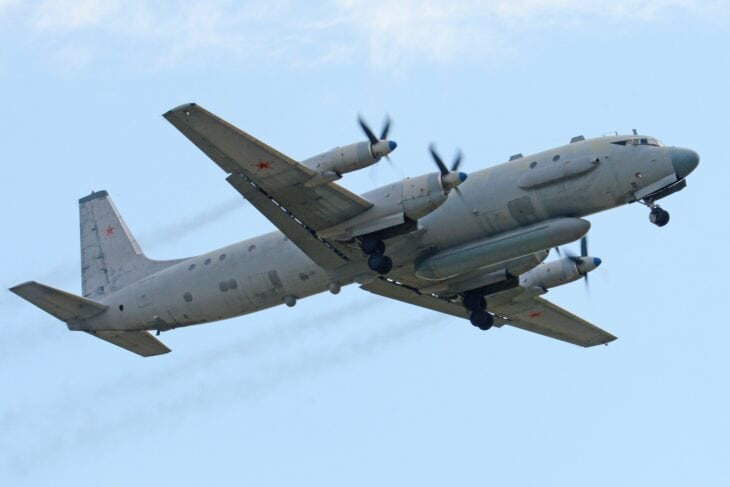 Russian Ilyushin Il-20M Coot reconnaissance aircraft climbing with its long belly sensor pod visible