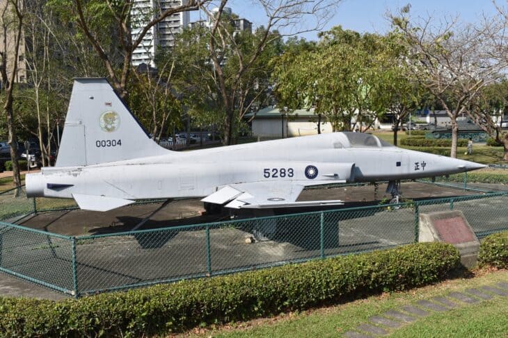 Republic of China Air Force Northrop F-5E Tiger II, serial 5283, preserved on display behind a fence in a Taichung memorial park