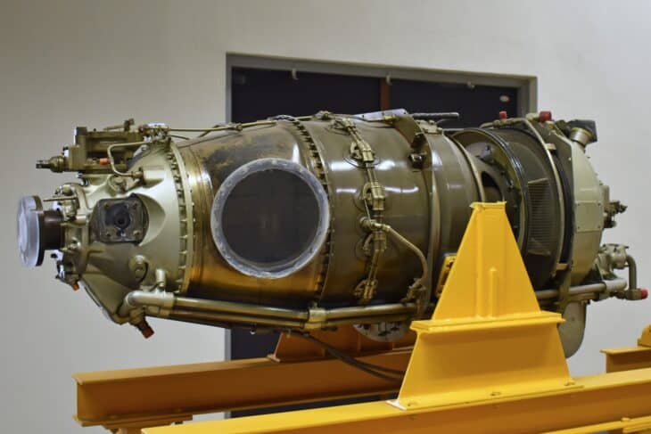 Pratt & Whitney Canada PT6A-25A turboprop engine on a yellow display stand at the Republic of China Air Force Museum