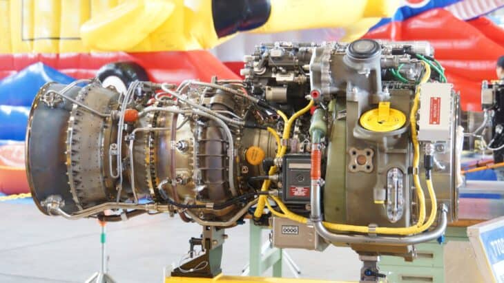 T700-IHI-401C turboshaft engine from a UH-60J helicopter on a display stand, right side view