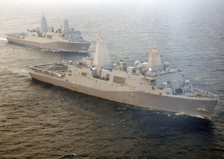 Two San Antonio-class amphibious transport dock ships steaming together in the Atlantic Ocean