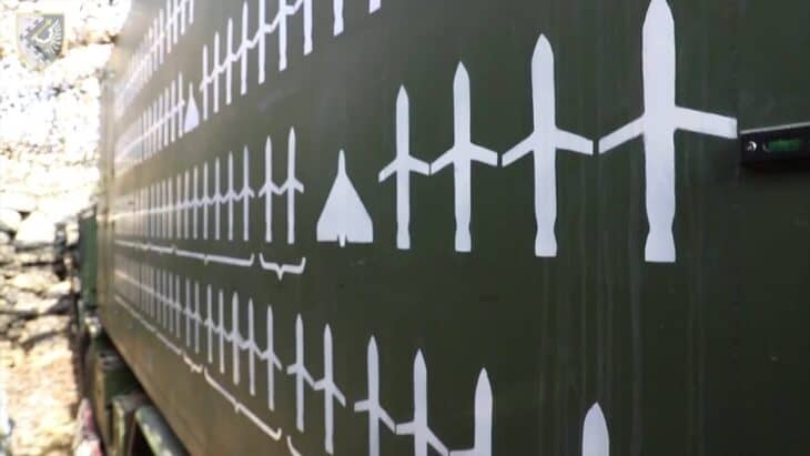 A Ukrainian IRIS-T SLM air defense launcher with rows of painted markings recording intercepts