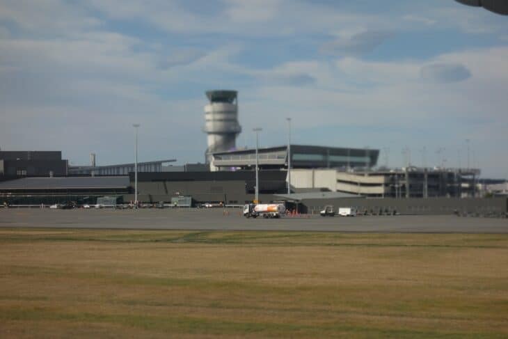 Control tower and terminal buildings at Christchurch International Airport seen across the airfield