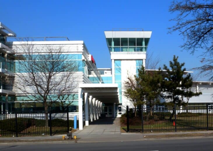 Vaughn College building with a control-tower-style glass cupola near LaGuardia Airport