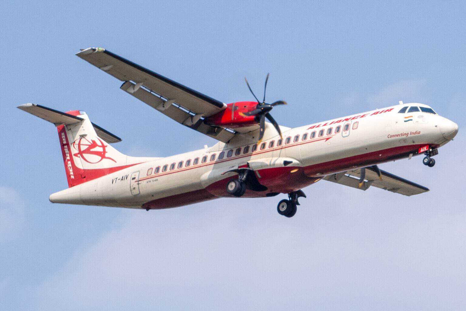 Alliance Air ATR 72-600 VT-AIV in flight on approach with landing gear down against a blue sky
