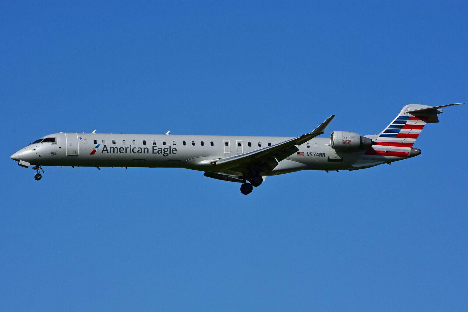 PSA Airlines CRJ900 N574NN in American Eagle livery on approach with gear down