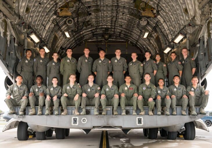 Air Force JROTC cadets posing in front of a C-17 cargo aircraft