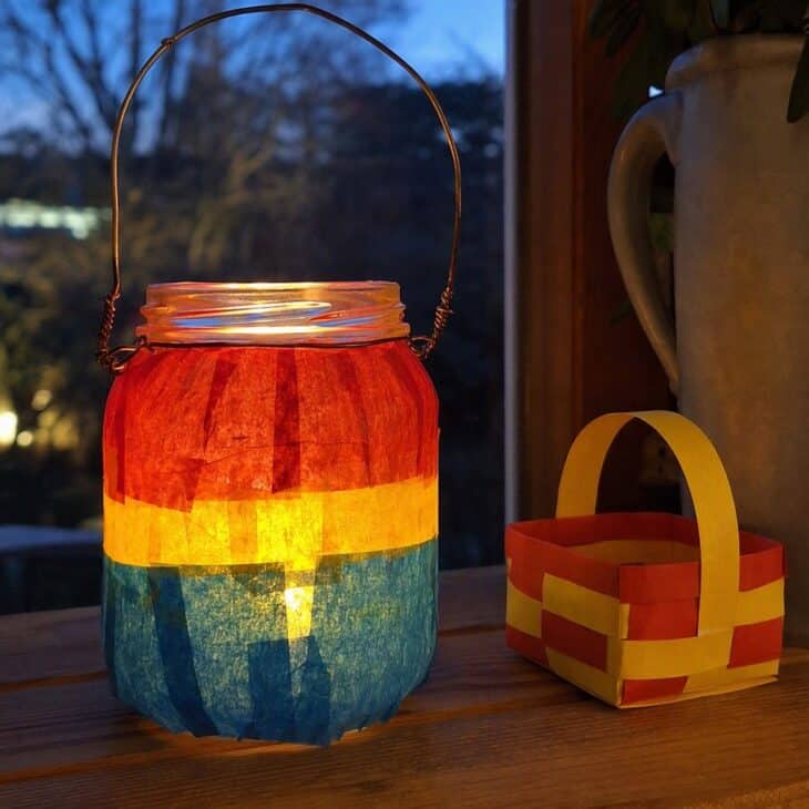 A tea light inside makes the tissue stripes glow like a lit balloon.