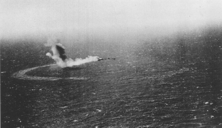 USS Neosho on fire and sinking in the Coral Sea after the Japanese dive-bomber attack of May 7, 1942