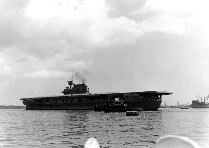 USS Yorktown arriving at Pearl Harbor on May 27, 1942, with her crew paraded on the flight deck