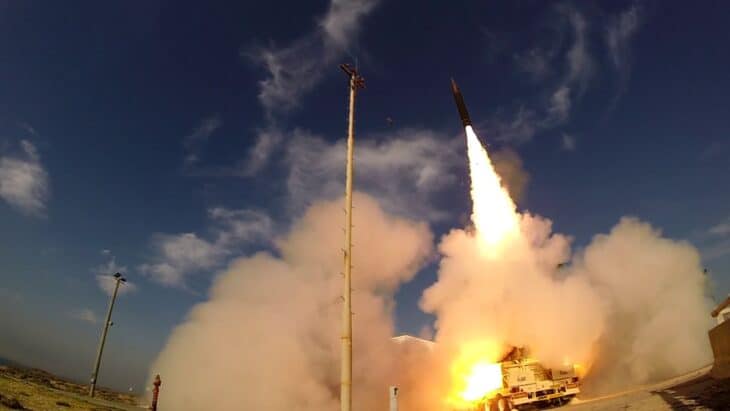 Arrow 3 interceptor lifting off from its launcher in a cloud of fire and smoke