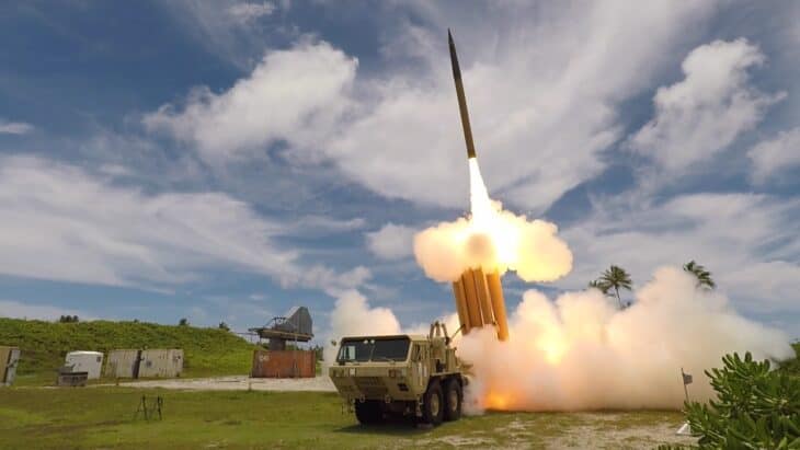 THAAD interceptor rising from its truck-mounted launcher in a cloud of exhaust during a flight test