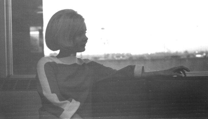 Vintage black-and-white portrait of a United Airlines stewardess at Portland