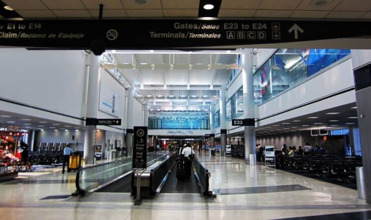 Concourse interior at George Bush Intercontinental Airport with escalators and gates