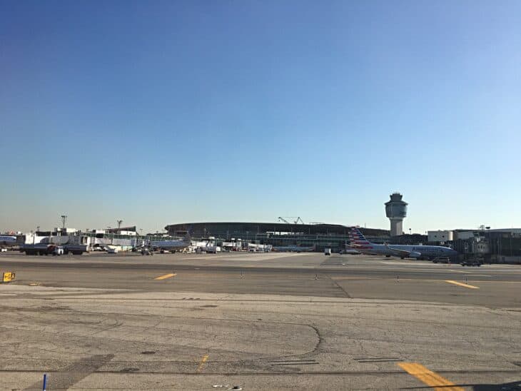LaGuardia's central terminal under construction, with the control tower beside it